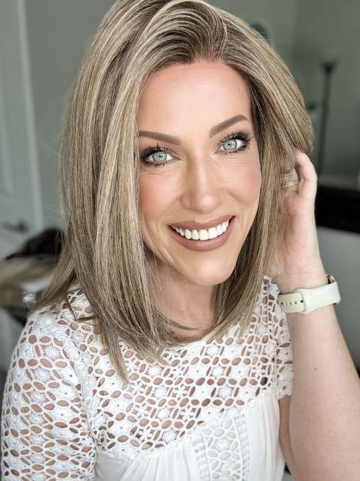 Smiling woman wearing Ellen Wille Drive wig shoulder length blonde bob with natural hairline and lace front