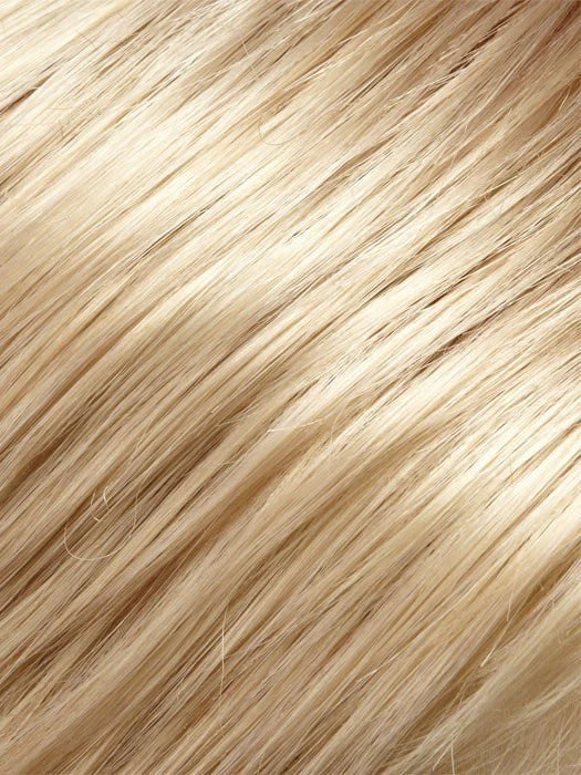 Close up blonde synthetic hair texture of childrens bob wig with bangs showing smooth silky strands