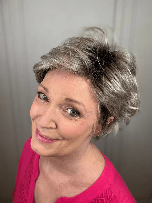 Ellen Wille Raise wig short silver layered pixie on smiling mature woman wearing pink top with volume and side swept bangs
