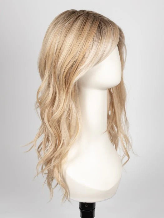 long wavy brown wig for women with light blonde balayage and side swept bangs on mannequin