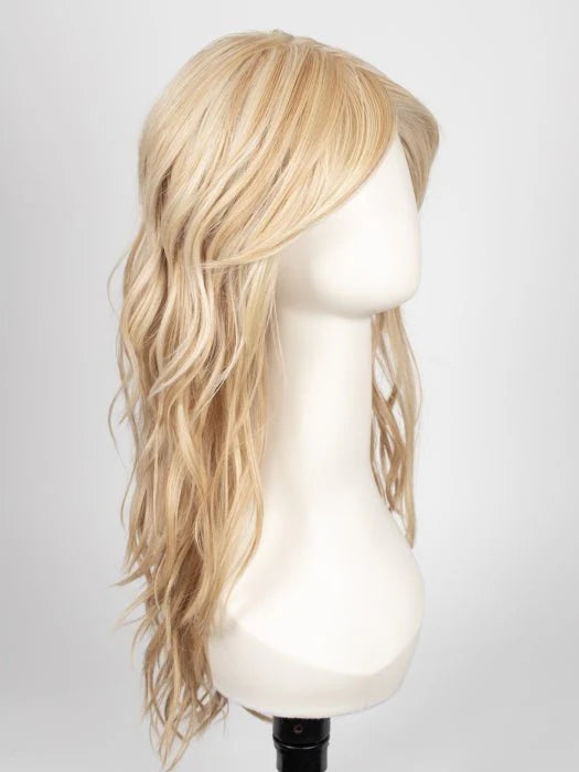 long wavy brown wig for women shown in light blonde sample on mannequin with side swept bangs